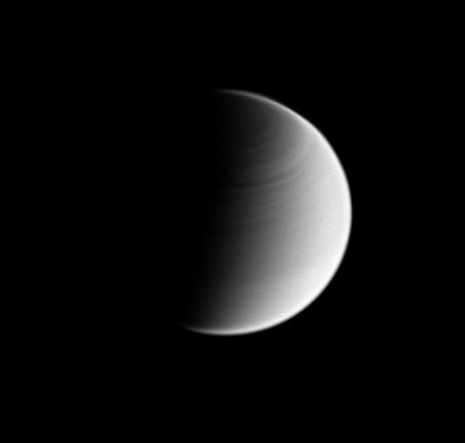 "Banded" Planet
Caption NASA:"This Cassini Spacecraft view of Titan shows banding in the Atmosphere of the moon's Northern Hemisphere. Like the planet Venus, Titan's atmosphere rotates faster than its surface, a characteristic called "Super-Rotation." 
North on Titan is up. 

White specks seen on Titan are artifacts of the process used to enhance features in the moon's Atmosphere. The image was taken in visible blue light with the Cassini Spacecraft wide-angle camera on May 28, 2008. The view was obtained at a distance of approx. 185.000 Km (such as about 115000 miles) from Titan and at a Sun-Titan-Spacecraft, or Phase, angle of 89°. 
Image scale is roughly 11 Km (about 7 miles) per pixel".
Parole chiave: Saturn's Moons - Titan