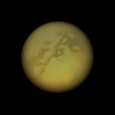 Looking for Clouds... (IR - natural - but enhanced - colors; credits: Lunexit)
Caption NASA:"The Cassini Spacecraft peeks through the murk of Titan's thick atmosphere in a search for clouds. Although there are no obvious cloud features in this view, bright cloud streaks have occasionally been seen by Cassini and Earth-based telescopes in the region seen here toward the bottom of Titan's disk. Repeated monitoring observations like this one help scientists build an understanding of Titan's weather and the various climate processes operating on this frigid, but remarkably Earth-like moon. 
This view looks toward the Saturn-facing Side of Titan (5150 kilometers, or 3200 miles across). North is up and rotated 35° to the left. 

The image was taken with the Cassini Spacecraft narrow-angle camera on Sept. 25, 2008 using a spectral filter sensitive to wavelengths of Infrared Light centered at 938 nanometers. The view was acquired at a distance of approx. 1,7 MKM (such as about 1 MMs) from Titan. 
Image scale is roughly 10 Km (approx. 6 miles) per pixel".
Parole chiave: Saturn's Moon - Titan