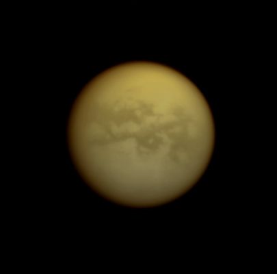 The "Foggy" Moon (IR Light - possible True Colors; credits: Lunexit)
Caption NASA:"The Cassini Spacecraft looks through Titan's thick atmosphere to reveal bright and dark terrains on the Saturn-facing Side of the Planet's largest moon. North is up. 

The image was taken with the Cassini Spacecraft narrow-angle camera on Oct. 11, 2008 using a spectral filter sensitive to wavelengths of IR Light centered at 938 nanometers. The view was obtained at a distance of approx. 2,2 MKM (about 1,3 MMs) from Titan and at a Sun-Titan-Spacecraft, or Phase, Angle of 10°. 
Image scale is roughly 13 Km (about 8 miles) per pixel".
Parole chiave: Saturn's Moon - Titan