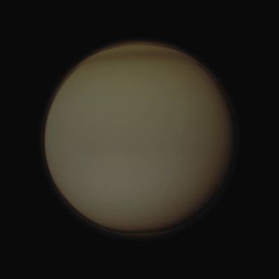 Titan's North Polar "Hood" (Darkened Absolute Natural Colors; credits for the additional process. and color.: Dr Paolo C. Fienga - Lunexit Team)
Caption NASA:"The Cassini spacecraft examines Titan's north polar hood, the part of the atmosphere of Saturn's largest moon appearing dark at the top of this image. This view looks toward the Anti-Saturn Side of Titan. 
North on Titan is up. The South Pole of Titan is going into darkness, with the Sun advancing towards the North with each passing day. The upper layer of Titan's Hazes is still illuminated by Sunlight scattered off the Planet.

The image was taken in Visible Violet Light with the Cassini Spacecraft wide-angle camera on April 19, 2011. The view was acquired at a distance of approx. 137.000 Km (about 85.000 miles) from Titan and at a Sun-Titan-Spacecraft, or Phase, Angle of 18°. Image scale is roughly 8 Km (about 5 miles) per pixel".
Parole chiave: Titan