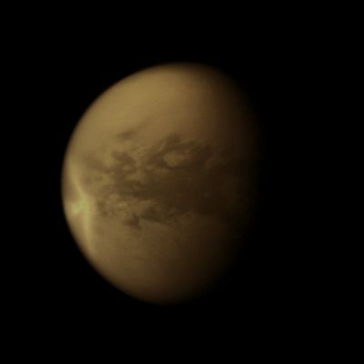 Titanian "Arrow-shaped Storm" (Natural Colors; credits for the additional process. and color.: Dr Paolo C. Fienga - Lunexit Team)
Caption NASA:"A huge arrow-shaped Storm blows across the Equatorial Regions of Titan in this image from NASA's Cassini Spacecraft, chronicling the Seasonal Weather Changes on Saturn's largest moon.

This Storm created large effects in the form of dark -- likely wet -- areas on the Surface of Titan, as better visible in later images. After this Storm dissipated, Cassini observed significant changes on Titan's Surface at the Southern Boundary of the Dunefield named Belet. 
Those changes covered an area of approx. 500.000 square Km (310.500 square miles), or roughly the combined area of Arizona and Utah in the United States. 
The part of the Storm that is visible here measures approx. 1200 Km (745,2 miles) in length East-to-West. The wings of the Storm that trail off to the North/West and South/West from the Easternmost point of the storm are each approx. 1500 Km (931,5 miles) long.

Titan's weather has been changing since the August 2009 Equinox, when the Sun lays directly over the Equators of Saturn and its moons, and Storms at low Latitudes are now more common.

This image is a mosaic of two Cassini images. Most of this view is from an image of the storm captured on Sept. 27, 2010. However, because that image's framing cut off the South Polar Region of the Planet, a second image of Titan, taken on July 9, 2010, was used to fill in that portion of the celestial body. This second image was re-projected to the same Viewing Geometry as the first.
Lit Terrain seen here is in the area between the Trailing Hemisphere, which is the side of Titan that faces backward in its orbit around Saturn, and the side of Titan that always faces away from Saturn. North on Titan is up. 

The images were taken with the Cassini Spacecraft narrow-angle camera using a spectral filter of Near-InfraRed Light centered at 938 nanometers. The view was acquired at a distance of approx. 1,3 MKM (807.300 miles) from Titan and at a sun-Titan-Spacecraft, or Phase, Angle of 44°. 
Image scale is roghly 8 Km (4,968 miles) per pixel".
Parole chiave: Titan
