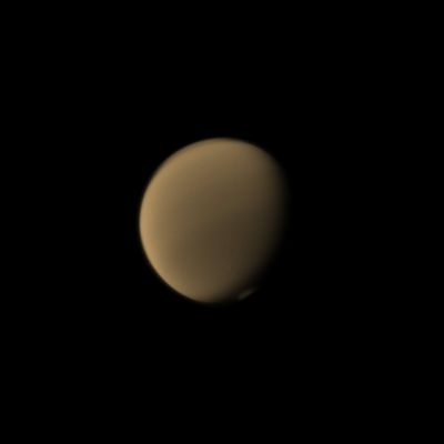 Titanian Restlessness (Absolute Natural Colors; credits for the additional process. and color.: Dr Paolo C. Fienga/Lunar Explorer Italia/Italian Planetary Foundation)
Titan's restless Upper Atmosphere puts on a display with the "detached" Haze to the North (---> the so-called "North Polar Hood" - top of image) and the Polar Vortex to the South.

This view looks toward the Saturn-facing Hemisphere of Titan; North is up and rotated 24° to the left. The image was taken with the NASA - Cassini Spacecraft Narrow-Angle Camera on August 20, 2013 using a Spectral Filter sensitive to Wavelengths of Near-InfraRed Light centered at 889 nanometers. The view was obtained at a distance of approximately 1,6 Million Miles (such as a little less than 2,575 Million KiloMeters) from Titan; the image scale is roughly 9 miles (such as approx. 14,484 Km) per pixel. 

This frame (which is an Original NASA - CASSINI Spacecraft's b/w and NON Map-Projected image published on the NASA - Planetary Photojournal with the ID n. PIA 17151) has been additionally processed, contrast enhanced, magnified to aid the visibility of the details, Gamma corrected and then colorized - according to an educated guess (or, if you wish, an informed speculation) carried out by Dr Paolo C. Fienga - in Absolute Natural Colors (such as the colors that a human eye would actually perceive if someone were onboard the NASA - Cassini Spacecraft and then looked outside, towards the Saturnian moon "Titan"), by using an original technique created - and, in time, dramatically improved - by the Lunar Explorer Italia Team. Different colors, as well as different shades of the same color, mean, among other things, the existence of different Elements (Gases) present in the Atmosphere of Titan, each having a different Albedo (---> Reflectivity) and Chemical Composition.

Note: it is possible (but we, as IPF, have no way to be one-hundred-percent sure of such a circumstance), that the actual luminosity of Titan - as it is in this frame - would appear, to an average human eye, a little bit lower than it has been shown (or, better yet: interpreted) here.
Parole chiave: Titan