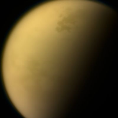Titan
Caption NASA Originale:"As it glanced around the Saturn system one final time, NASA's Cassini Spacecraft captured this view of the planet's giant moon Titan. Interest in mysterious Titan was a major motivating factor to return to Saturn with Cassini-Huygens following the Voyager mission fly-bys of the early 1980s. Cassini and its Huygens probe, supplied by the ESA (European Space Agency), revealed the moon to be every bit as fascinating as scientists had hoped.

These views were obtained by Cassini's Narrow-Angle Camera on Sept. 13, 2017. They are among the last images Cassini sent back to Earth. 

This natural color view, made from images taken using red, green and blue spectral filters, shows Titan much as Voyager saw it - a mostly featureless golden orb, swathed in a dense Atmospheric Haze. An enhanced-color view (such as this one) adds to this color a separate view taken using a spectral filter (centered at 938 nanometers) that can partially see through the haze.

The views were acquired at a distance of about 481.000 miles (such as approx. 774.094,464 Km) from Titan. The image scale is about 3 miles (roughly 4,828 Km) per pixel".
Parole chiave: Titan