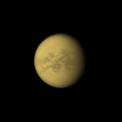 Aztlan, Fensal and Senkyo Region (Absolute Natural Colors; credits: Dr Paolo C. Fienga - Lunexit Team)
Caption NASA:"The Cassini Spacecraft looks toward the dark Senkyo Region on Saturn's moon Titan.
Senkyo is the Dark Region towards the right. Two other Dark Regions, Aztlan (to the left, slanting down below the Equator) and Fensal (left, North of Aztlan), are also shown here. 
The bright area below Aztlan is called Tsegihi. This view looks toward the Saturn-facing Side of Titan. North on Titan is up and rotated 9° to the left.

The image was taken with the Cassini Spacecraft narrow-angle camera on April 8, 2010 using a spectral filter sensitive to wavelengths of Near-InfraRed Light centered at 938 nanometers. The view was obtained at a distance of approx. 2,1 MKM (about 1,3 MMs) from Titan and at a Sun-Titan-Spacecraft, or Phase, Angle of 33°. 
Image scale is roughly 12 Km (a little more than 7 miles) per pixel".
Parole chiave: Titan