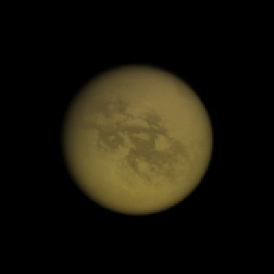 Kraken Mare (Natural Colors; credits: Lunexit)
Caption NASA:"In the top right of this Cassini image, the Southern end of Titan's huge lake of liquid hydrocarbons called Kraken Mare is visible near the moon's North Pole. 
See PIA11146 to learn more about Titan's lake districts and to see a map. 
Near the moon's Equator are the albedo features Senkyo on the right and Aztlan on the left. This view looks toward the Saturn-Facing Side of Titan. North is up and rotated 31° to the right. 

The image was taken with the Cassini Spacecraft wide-angle camera on Oct. 12, 2009 using a spectral filter sensitive to wavelengths of Near-InfraRed Light centered at 939 nanometers. 
The view was acquired at a distance of approx. 252.000 Km (about 157.000 miles) from Titan and at a Sun-Titan-Spacecraft, or Phase, Angle of 11°. 
Image scale is roughly 15 Km (a little more than 9 miles) per pixel".
Parole chiave: Titan