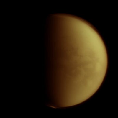 Senkyo Region (Absolute Natural Colors; credits for the additional process. and color.: Dr Paolo C. Fienga/Lunar Explorer Italia/Italian Planetary Foundation)
The NASA - Cassini Spacecraft's "Electronic Eyes" peer through Titan's thick layers of Clouds to spy on the Region dubbed "Senkyo" by Planetary Scientists. Among the Dark Surface Features visible in this picture there is also a very vast Field of Dunes, possibly composed of solid Hydrocarbon Particles precipitated out of the Titanian Atmosphere; furthermore, the South Pole of Titan is, as you can see, still shrouded in the huge Vortex that formed only a few months ago (and whose origin is still debated). The lit Terrain seen here is located on the Saturn-facing Hemisphere of Titan; North is up and rotated 18° to the right. 

This image was taken with the NASA - Cassini Spacecraft's Narrow-Angle Camera on January 5, 2013, by using a spectral filter sensitive to Wavelengths of Near-InfraRed Light centered at 938 Nanometers. The view was obtained at a distance of approximately 750.000 miles (such as a little more than 1,2 Million KiloMeters) from Titan and at a Sun-Titan-Cassini Spacecraft , or Phase, Angle of 79°. Image scale is roughly 4 miles (such as about 6,43 Km) per pixel. 

This picture (which is an Original NASA - Cassini Spacecraft b/w frame published on the NASA - Planetary Photojournal and identified by the n. PIA 14655) has been additionally processed and then colorized, according to an educated guess carried out by Dr Paolo C. Fienga (LXTT-IPF), in Absolute Natural Colors (such as the colors that a human eye would actually perceive if someone were onboard the NASA - Cassini Spacecraft and then looked outside, towards the Saturnian moon Titan), by using an original technique created - and, in time, dramatically improved - by the Lunar Explorer Italia Team. Different colors, as well as different shades of the same color, mean, among others, the existence of different Elements present in the Atmosphere of Titan, each having a different Albedo (---> Reflectivity) and Chemical Composition. 

Note: it is possible (but we, as IPF, have no way to be one-hundred-percent sure of such a circumstance), that the actual luminosity of the Clouds and Hazes (as well as the luminosity of Titan itself) seen in this frame would appear, to an average human eye, way lower than it has been shown (or, better yet: interpreted) here.
Parole chiave: Titan