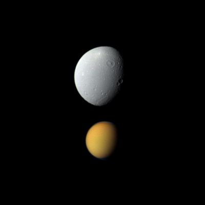 Titan and Dione (Natural Colors; credits: NASA/JPL-Caltech/Space Science Institute)
Caption NASA:"Saturn's largest moon, Titan, appears deceptively small paired here with Dione, Saturn's third-largest moon, in this view from NASA's Cassini Spacecraft. Titan (which is approx. 3200 miles or about 5150 Km across) is much farther from the Spacecraft than Dione (that, on its side, is approx. 698 miles or about 1123 KM across) is in this view. The view was captured at a distance of approx. 684.000 miles (such as about 1,1 MKM) from Titan but only about 85.000 miles (such as approx. 136.000 Km) from Dione.
Titan appears in its True Colors, but it has been brightened by a factor of about 1,6 relative to Dione. This view looks toward the Saturn-facing side of Titan and the area between the Saturn-facing side and Leading Hemisphere of Dione. North is up on both moons.

Images taken using red, green and blue spectral filters were combined to create this Natural Color view. The images were obtained with the Cassini Spacecraft wide-angle camera on Nov. 6, 2011. Scale in the original image was roughly 5 miles (such as approx. 8 Km) per pixel on Dione and roughly 41 miles (about 66 Km) per pixel on Titan. The image has been magnified by a factor of 1,5 and contrast-enhanced to aid visibility".
Parole chiave: Saturnian Moons - Dione and Titan