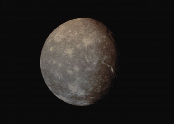 Titania (Absolute Natural Colors; credits for the additional process. and color.: Dr Paolo C. Fienga/Lunar Explorer Italia/Italian Planetary Foundation)
Caption NASA:"Voyager 2 obtained this full-disk view of Uranus' moon Titania in the early morning hours of Jan. 24, 1986, from a distance of about 500.000 Km (approx. 300.000 miles). Many circular depressions -- probably impact craters -- are visible in this clear-filter image returned by the Voyager narrow-angle camera. 
Other bright spots are distinguished by radiating rays and are probably halo craters that mark relatively more recent impacts. Even more interesting are Linear Troughs (right) that are probably Fault Canyons (Tectonic Fractures). The Troughs break the crust in two directions, an indication of some tectonic extension of Titania's crust. These features indicate that this icy satellite has a dynamic, active interior. Titania is about 1600 Km (approx. 1000 mi) in diameter; the resolution of this image is about 9 Km (approx. 6 mi) per pixel". 
Parole chiave: Uranian Moons - Titania