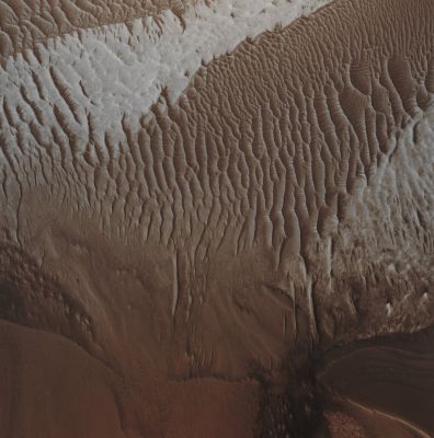 Features of Tithonium Chasma (Absolute Natural Colors; credits for the additional process. and color: Dr Paolo C. Fienga - Lunexit Team)
Caption NASA originale:"This MGS-MOC image shows dark rippled surfaces and a patch of light-toned, perhaps sedimentary rock exposed on the floor of western Tithonium Chasma, part of the vast Valles Marineris Canyon System". 

Location near: 5,0° South Lat. and 90,3° West Long.
Image width: ~3 Km (~1,9 mi) 
Illumination from: lower left 
Season Southern Spring
Parole chiave: Mars from orbit - Chasmas - Tithonium Chasma