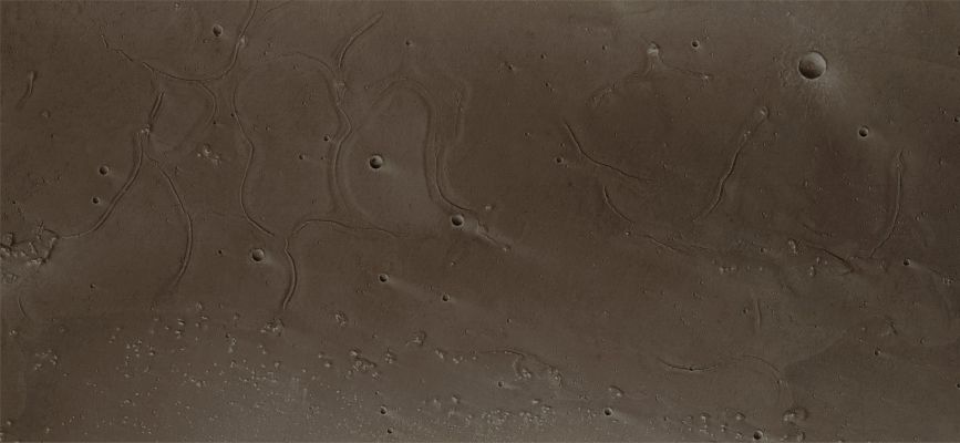 Tiu Valles (Natural Colors; credits: Dr Paolo C. Fienga - Lunexit Team)
This image taken by the High Resolution Stereo Camera (HRSC) on board Mars Express shows the mouth of the Tiu Valles Channel System on the Red Planet. The picture was taken in orbit 3103 on 10 June 2006 with a ground resolution of approx. 16 mt/pixel. Visible in the lower part of the image are remnants of a once 'Streamlined' Island. The upper part of the scene covers the mouth of the Tiu Valles nearly in its entire width, approx. 55 Km. 
Its winding, meandering Ridges, bound by depressions are eye-catching. The processes that formed these odd structures are still unknown. Possibly, during flooding events, water or water-rich surface layers came in contact with lava from the surrounding areas, which then might have led to the formation of these mysterious ridges. 

The Region is located at approx. 27° North Lat. and 330° East Long. The Sun illuminates the scene from the North West, the lower left-hand side in the image. 
Parole chiave: Mars from orbit - Tiu Valles