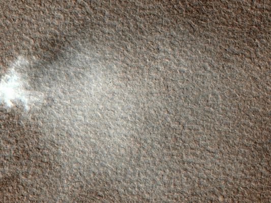 Caught in the Act (Natural Colors; credits: NASA/JPL-Caltech/University of Arizona - Additional process. and color.: Dr Paolo C. Fienga - Lunexit Team)
This image was targeted to study Knobs in Mars' Northern Plains (Vastitas Borealis), just North of Scandia Crater. What surprised scientists was the presence of a Dust Devil passing by.

As on Earth, Dust Devils form when ground heated by sunlight warms the air above it. The hot air rises, forming an updraft accompanied by vortical motions. 
Because warm ground is a requirement, Dust Devils on Mars generally form in late Spring to Summer, especially at high Latitudes.

This image was taken in early Spring (2010), at a latitude of about 61° North. No Dust Devil has been seen this far from the Equator at such an early season before.
Parole chiave: Mars from orbit - Vastitas Borealis