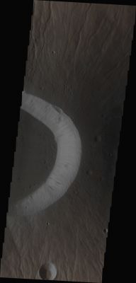 The Eastern Side of Ceraunius Tholus' Summit Caldera (Absolute Natural Colors; credits for the additional process. and color.: Dr Paolo C. Fienga/Lunar Explorer Italia/Italian Planetary Foundation)
This image (taken by the NASA - Mars Odyssey Orbiter during its 47827th orbit around the Red Planet) shows us the Eastern Side of the Summit Caldera of a Volcano known as Ceraunius Tholus (which is part, jointly with Uranius Mons and Uranius Tholus, of the so-called "Uranius Group of Volcanoes"). Ceraunius Tholus is approx. 130 Km across and approx. 5,5 Km high; it was so named after a Classical Albedo Feature and it is located in the Tharsis Quadrangle of Mars. Ceraunius Tholus is generally believed to be a Basaltic Shield-Volcano with the lower part buried beneath the lava-formed Plains forming. Earlier interpretations suggested also that it may be a "Stratovolcano". The Slopes on Ceraunius Tholus are quite steep with an average slope of 8° and with many Radial Erosional Channels and Pitted Valleys extending from just below the Rim of the Caldera, toward the base of the Volcano. The current view, however, is that the Valleys were eroded by Water. Interesting features that characterize Ceraunius Tholus are 3 (three) large Canyons located on the North/Western Flank of the Volcano and which are up to approx. 2,5 km wide and 300 meters deep. The biggest of these 3 (three) Canyons also appears to be the youngest one; it protrudes from the lowest point of the Volcanic Summit Caldera and it ends at the interesting Rahe Crater (an oblique Impact Crater with measures of about 35 × 18 Km), just North from the Volcano, where it formed a Depositional Fan. Its origin is (let us say, "obviously") still debatable and there are at least 3 (three) Main Models proposed to explain it: Creation by way of Fluvial Action, Volcanic (---> Lava) Flows or a combination of both of them. The Caldera of Ceranius Tholus is also dotted with many Collapse Pits (NOT visible in this frame), which, as you should know, are distinct from Impact Craters since they have no Rim and vary in abundance all across the Caldera. Some scientists believe that Glaciers may have existed on many of the Volcanoes located in the District of Tharsis, including Olympus Mons, Ascraeus Mons, and Pavonis Mons. Ceraunius Tholus, on uts side, may also have had its Glaciers Melt to form some temporary Lakes in the past. In fact, the smoothness and flatness of the Ceraunius Tholus' Summit Caldera Floor strongly suggests that, in a far and distant past, some meltwater might actually have accumulated over there, thus forming a so-called (and just temporary, as we said before) "Caldera Lake".

Latitude (centered): 24,0691° North
Longitude: 263,105° East 
Instrument: VIS 
Captured: September, 25th, 2012

This frame (which is an Original Mars Odyssey Orbiter b/w frame published on the NASA - Planetary Photojournal with the ID n. PIA 16595) has been additionally processed and then colorized in Absolute Natural Colors (such as the colors that a human eye would actually perceive if someone were onboard the NASA - Mars Odyssey Orbiter and then looked down, towards the Surface of Mars), by using an original technique created - and, in time, dramatically improved - by the Lunar Explorer Italia Team.
Parole chiave: Mars from orbit - Volcanoes - Ceraunius Tholus