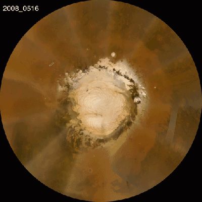 Clear Skies over the Northern Regions (GIF-Movie; credits: NASA)
Scientists are anticipating clear skies when NASA's Phoenix Mars Lander arrives on the north polar plains of the Red Planet Sunday, May 25, 2008. 

This orbital view of the north polar region of Mars, where NASA's Phoenix Mars Lander will land, shows clear skies as of May 22, 2008. Mission planners are always on the lookout for dust storms in daily weather updates like this one, provided by the Mars Color Imager on NASA's Mars Reconnaissance Orbiter. Based on current conditions, they are predicting good weather when Phoenix arrives May 25, 2008. 

Temperature profiles, used to calculate atmospheric density, are also updated on a regular basis, provided by the Mars Climate Sounder, another instrument on the Mars Reconnaissance Orbiter. Atmospheric density was well within expectations as of May 22, 2008. Mission planners will continue to receive updates on weather and atmospheric conditions prior to landing. 

The animated orbital view shows recent weather conditions from May 16 to May 22, 2008, as tracked by the Mars Color Imager on NASA's Mars Reconnaissance Orbiter. A cloud of dust kicked up by Martian winds traveled from west to east between May 19 and May 22, 2008, passing over Phoenix's landing site. The dust cloud was about 500 kilometers (300 miles) from head to tail and made the skies somewhat hazy. Since then, the dust has been replaced by clear skies, indicating that Phoenix will not land in any dust clouds, which are a common occurrence in the northern latitudes of Mars. 


Parole chiave: GIF-Movie