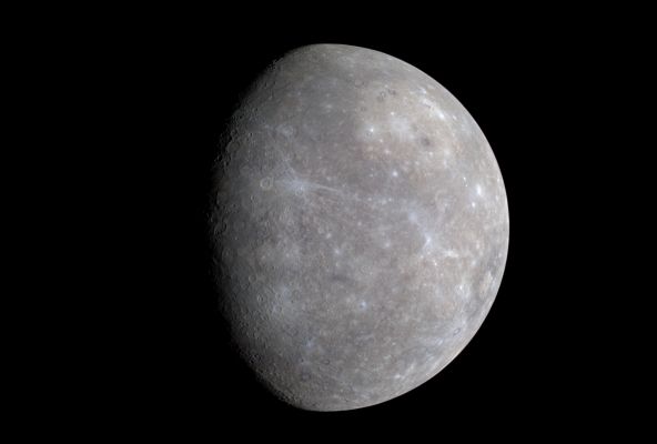 Crescent Mercury (in Accentuated Colors; credits: NASA)
Caption NASA:"The colors of Mercury are subtle but beautiful. At first glance, our Solar System's innermost Planet appears simply black and white, but images that include IR colors normally beyond human vision accentuate a world of detail. One such image, shown above, was acquired by the robotic MESSENGER Spacecraft that swung by Mercury in mid-January 2008. 
Here, most generally, the hot world itself acquires a slightly more brown hue. Many craters that appear on top of other craters - and so surely have formed more recently - appear here as bright with bright rays that include a slightly blue tint, indicating that soil upended during the impact was light in color. A few craters, such as some in the huge Caloris Basin impact feature visible on the upper right, appear unexpectedly to be ringed with a dark material, the nature of which is being researched. 
MESSENGER continues to glide through the inner Solar System and will pass Mercury again this October and next September, before entering orbit around the desolate world in 2011".
Parole chiave: Mercury Fly-By