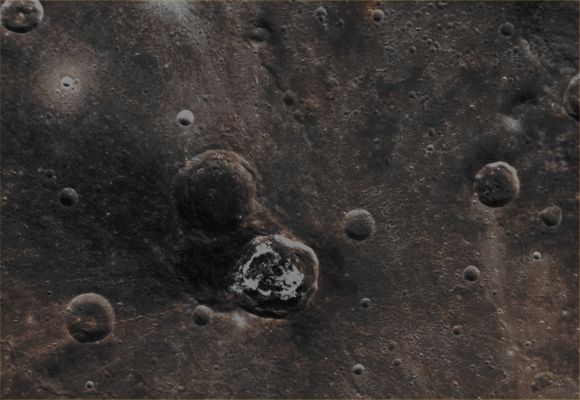 Balanchine Crater (EDM - Absolute Natural Colors; credts for the additional process. and color.: Dr Paolo C. Fienga/Lunar Explorer Italia/Italian Planetary Foundation)
The Impact Crater visible at the center of this scene (such as the one whose Floor is largely covered by extremely bright - and therefore, here, slightly over-exposed - Hollows) has been named "Balanchine", after the choreographer George Balanchine (Leningrad, 1904/New York City - NY - 1983). Now, if you carefully take a look at the Ejecta Blanket which emanates from Balanchine Crater, you may ask yourself what could have caused such an Asymmetric Pattern. Obviously, no one can give an absolutely definitive answer to this kind of question, as you should know, but a reasonable possibility is that the irregularly shaped Ejecta Pattern of Balanchine Crater formed (perhaps just in part) on top of a similarly sized, and pre-existing, Impact Crater. 
In this scenario, the older Impact Crater could have unearthed the Lower Reflectance dark-gray Deposit (which, by the way, appear blue in the Original NASA false color image-mosaic) from beneath the Surface, while, some time (perhaps a few millions of years) afterwards, a certain portion of them was (unevenly) redistributed all over the Mercurian Surface by the impact that formed Balanchine. 

Date acquired: June 29th, 2011
Images Mission Elapsed Time (MET): 217863931, 217863927, 217863923 
Images ID: 441964, 441963, 441962
Instrument: Wide Angle Camera (WAC) of the Mercury Dual Imaging System (MDIS)
Center Latitude: 39,05° North
Center Longitude: 175,80° East
Resolution: 282 meters/pixel
Solar Incidence Angle: 39,6° (meaning that the Sun, at the time that the picture was taken, was about 50,4° above the imaged Local Mercurian Horizon)
Emission Angle: 6,3°
Sun-Mercury-Messenger (or "Phase") Angle: 40,9°

This picture (which is a crop taken from an Original NASA - MESSENGER Spacecraft Map Projected false color image-mosaic published on the NASA - Planetary Photojournal with the ID n. PIA 17057) has been additionally processed, contrast enhanced, magnified and then re-colorized in Absolute Natural Colors (such as the colors that a human eye would actually perceive if someone were onboard the NASA - MESSENGER Spacecraft and then looked down, towards the Surface of Mercury), by using an original technique created - and, in time, dramatically improved - by the Lunar Explorer Italia Team. Different colors, as well as different shades of the same color, mean, among other things, the existence of different Elements (Minerals) present on the Surface of Mercury, each having a different Albedo (---> Reflectivity) and Chemical Composition.
Parole chiave: Mercury from orbit - Craters - Balanchine Crater