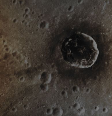 Berkel Crater (Absolute Natural Colors; credts for the additional process. and color.: Dr Paolo C. Fienga/Lunar Explorer Italia/Italian Planetary Foundation)
Berkel Crater (a Mercurian Impact Crater that was so named after the Turkish painter and printmaker, Sabri Berkel) is a so-called "Complex Impact Crater" (approx. 24 Km - such as a little less than 15 miles - in diameter) that sits inside the larger Ellington Basin, which is located in the low Latitudes of the Southern Hemisphere of Mercury. Berkel's interior contains some kind of Material (so far unknown) that, as you can clearly see in today's image, is way darker than the surrounding Terrain; furthermore, a large number of the vey common Mercurian Surface Features, known as "Hollows", can also be seen all over the Floor of the Crater itself. 

This image was acquired as a targeted set of stereo images. Targeted Stereo Observations are acquired at resolutions much higher than that of the 200-meter/pixel Stereo Base Map. These targets acquired with the NAC enable the detailed Topography of Mercury's Surface to be determined for a local area of specific interest.

Date acquired: February, 5th, 2013
Image Mission Elapsed Time (MET): 4159492 
Image ID: 3589683
Instrument: Narrow Angle Camera (NAC) of the Mercury Dual Imaging System (MDIS)
Center Latitude: 13,85° South
Center Longitude: 26,56° East
Resolution: 71 meters/pixel
Solar Incidence Angle: 30,3° (meaning that the Sun, at the time that the picture was taken, was about 59,7° above the imaged Local Mercurian Horizon)
Emission Angle: 29,3°
Sun-Mercury-Messenger (or "Phase") Angle: 52,6°

This picture (which is an Original NASA - MESSENGER Spacecraft b/w frame published on the NASA - Planetary Photojournal with the ID n. PIA 16890) has been additionally processed and then colorized in Absolute Natural Colors (such as the colors that a human eye would actually perceive if someone were onboard the NASA - MESSENGER Spacecraft and then looked down, towards the Surface of Mercury), by using an original technique created - and, in time, dramatically improved - by the Lunar Explorer Italia Team. Different colors, as well as different shades of the same color, mean, among other things, the existence of different Elements (Minerals) present on the Surface of Mercury, each having a different Albedo (---> Reflectivity) and Chemical Composition.
Parole chiave: Mercury from orbit - Craters - Berkel Crater