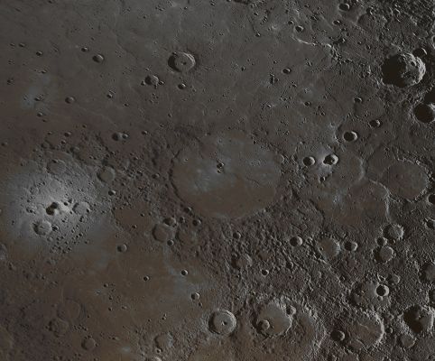Copland on Mercury (Natural Colors; credits for the additional process. and color.: Dr Paolo C. Fienga - Lunexit Team)
Visible in the center of this image is the Crater Copland, recently named in honor of the American composer and pianist Aaron Copland. 
Aaron Copland and this Crater are both unquestionably worthy candidates for named features on Mercury, but how this specific crater came to be known as Copland has an interesting back-story. 
Amateur astronomer Ronald Dantowitz and his colleagues Scott Teare and Marek Kozubal used the Mt. Wilson 60-inch telescope in 1998 to observe a very bright feature on this portion of Mercury's surface, and they assumed that the bright feature was an impact crater. 
Mr. Dantowitz expressed his wish that the crater be named "Copland" once better images of the area were obtained from spacecraft. Surprisingly, MESSENGER images from Mercury flyby 3 revealed that the small bright feature, seen at the left edge of this image, is not an impact crater but more closely resembles a Volcanic Vent. 
No convention for naming Volcanic Vents on Mercury has yet been adopted, because none were identified prior to MESSENGER's first Mercury flyby. However, even if a convention for naming volcanic features on Mercury is adopted in the future, the naming rules will likely differ from those for impact craters, and thus "Copland" would probably not be an acceptable name for the bright volcanic feature. 
A MESSENGER team member corresponded with Mr. Dantowitz and suggested that the name Copland be proposed instead for a large crater nearby. 
He agreed, and the International Astronomical Union (IAU) approved the name Copland on March 3, 2010. Copland crater is flooded with volcanic smooth plains material that could be related to the activity that formed the bright vent.

Date Acquired: September 29, 2009
Instrument: Narrow Angle Camera (WAC) of the Mercury Dual Imaging System (MDIS)
Scale: Copland crater has a diameter of about 208 Km (approx. 129 miles)
Projection: This image is a portion of the NAC approach mosaic from Mercury flyby 3. It is shown in a simple cylindrical map projection with a resolution of roughly 500 meters/pixel (approx. 0,31 miles/pixel).
Parole chiave: Mercury