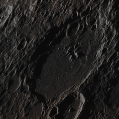 Eitoku Crater (Absolute Natural Colors; credits for the additional process. and color.: Dr Paolo C. Fienga/Lunar Explorer Italia/Italian Planetary Foundation)
The main and really impressive Impact Crater visible in this NASA - MESSENGER Spacecraft image, Eitoku (which has a diameter of approx. 100 Km - such as about 62 miles) , displays several (almost) Central Peaks that appear especially prominent due to the high Solar Incidence Angle (meaning that the Sun was setting onto the imaged Local Horizon at the time that this picture was taken - and therefore the shadows of each and every Mercurian relief resulted way more visible - i.e.: longer - and suggestive) as well as to the fact that this frame has not been Map Projected. Note that Central (and/or almost Central, like in this case) Peaks are a relatively common Feature in Mercury's larger Impact Craters. Note, also, that the smaller Impact Craters visible on the Floor and Rim (which, on its side, appears quite degraded) of Eitoku Crater indicate/suggest that we are actually looking at an old Impact Feature.

Date acquired: July, 3rd, 2012
Image Mission Elapsed Time (MET): 249790754
Image ID: 2129670
Instrument: Narrow Angle Camera (NAC) of the Mercury Dual Imaging System (MDIS)
Center Latitude: 21,77° South
Center Longitude: 202,6° East
Resolution: 120 meters/pixel
Solar Incidence Angle: 83,4° (meaning that the Sun, at the time that the picture was taken, was about 6,6° above the imaged Local Mercurian Horizon)
Emission Angle: 59,9°
Sun-Mercury-Messenger (or "Phase") Angle: 134,5°

This picture (which is an Original NASA - MESSENGER Spacecraft color frame published on the NASA - Planetary Photojournal with the ID n. PIA 16361) has been additionally processed and then colorized in Absolute Natural Colors (such as the colors that a human eye would actually perceive if someone were onboard the NASA - MESSENGER Spacecraft and then looked down, towards the Surface of Mercury), by using an original technique created - and, in time, dramatically improved - by the Lunar Explorer Italia Team. Different colors, as well as different shades of the same color, mean, among other things, the existence of different Elements (Minerals) present on the Surface of Mercury, each having a different Albedo (---> Reflectivity) and Chemical Composition.
Parole chiave: Mercury from orbit - Craters - Eitoku Crater