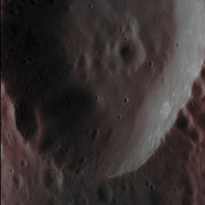 Unnamed Crater with Hollows (Absolute Natural Colors; credits for the additional process. and color.: Dr Paolo C. Fienga/Lunar Explorer Italia/Italian Planetary Foundation)
As the NASA - MESSENGER Spacecraft passes progressively closer to the Planet Mercury, we are able to see Always better resolved Surface Features in the images that the Spacecraft returns. Here, in this frame, at a pixel scale of 9 meters, we can see the Eastern Portion of an Unnamed Impact Crater approx. 13 Km (such as about 8,073 miles) in diameter. The Inner Wall of the Crater is replete (---> full of), as you can see, with smaller, superposed Impact Craters, some of which appear elongated (---> ellipsoidal), possibly because they impacted on the larger Crater's inclined Inner Wall. 

Interestingly, there are also Bright Spots on the Sunlit Portion of this Unnamed Crater's Wall (Right Side - Dx - of the frame, at about 4 o'clock), and that is exctly the right place where we might reasonably expect to see, in a near future, some new "Hollows" (actually, we, as IPF, do believe that the Surface Features visible in the area indicated by NASA are ALREADY FORMED "Hollows" whose shapes and dimensions, probably, are still in course of modification).

Date acquired: March, 3rd, 2014
Image Mission Elapsed Time (MET): 36136338
Image ID: 5862963
Instrument: Narrow Angle Camera (NAC) of the Mercury Dual Imaging System (MDIS)
Center Latitude: 56,30° North
Center Longitude: 301,60° East
Solar Incidence Angle: 59,3° (meaning that the Sun, at the time that the picture was taken, was about 30,7° above the imaged Local Mercurian Horizon)
Emission Angle: 43,0°
Sun-Mercury-Messenger (or "Phase") Angle: 102,3°

This picture (which is an Original NASA - MESSENGER Spacecraft's b/w and NON Map-Projected image published on the NASA - Planetary Photojournal with the ID n. PIA 18372) has been additionally processed, contrast enhanced, Gamma corrected, magnified to aid the visibility of the details and then colorized in Absolute Natural Colors (such as the colors that a human eye would actually perceive if someone were onboard the NASA - MESSENGER Spacecraft and then looked outside, towards the Surface of Mercury), by using an original technique created - and, in time, dramatically improved - by the Lunar Explorer Italia Team. Different colors, as well as different shades of the same color, mean, among other things, the existence of different Elements (Minerals) present on the Surface of Mercury, each having a different Albedo (---> Reflectivity) and Chemical Composition.
Parole chiave: Mercury from orbit - Craters - Unnamed Crater with Hollows