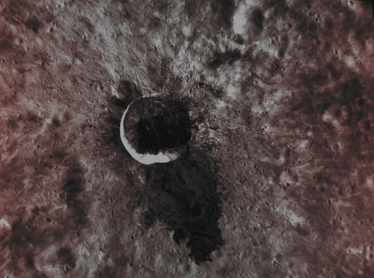 Waters Crater (EDM - Possible Absolute Natural Colors; credits for the additional process. and color.: Dr Paolo C. Fienga/Lunar Explorer Italia/Italian Planetary Foundation)
In this beautiful image, obtained by the NASA - MESSENGER Spacecraft on September, 16, 2013, we can see the extremely unusually-looking Impact Crater known as Waters. The South-heading Dark Impact Melt Flow of Waters Crater (approx. 15 Km - such as about 9,315 miles - in diameter and so named, in the AD 2012, after the blues legend Muddy Waters - Mc Kinley Morganfield, born in Issaquena County - Mississippi - USA -, on April 4, 1913 and deceased in Westmont, Illinois, on April 30, 1983) has always been - we'd say, obviously - a Surface Feature of great interest for Planetary Scientists, and the Targeted Color Imaging Campaign carried out by the NASA - MESSENGER Spacecraft showed quite well, and more than once, the distinctive dark gray-greenish-bluish color of the aforementioned Impact Melt Flow. 

As a consequence of such a great interest, during the late AD 2013, this High-Resolution Image was then acquired, and it revealed stunning new details (like the Wavy Texture) of the Impact Melt Flow - details which were (as far as their visual quality was and is concerned) way beyond the ones that had been photographed in other (previous) frames.

Date acquired: September, 16th, 2013
Image Mission Elapsed Time (MET): 21673915
Image ID: 4834878
Instrument: Narrow Angle Camera (NAC) of the Mercury Dual Imaging System (MDIS)
Center Latitude: 9,00° South
Center Longitude: 254,70° East
Solar Incidence Angle: 44,0° (meaning that the Sun, at the time that the picture was taken, was about 46,0° above the imaged Local Mercurian Horizon)
Emission Angle: 44,8°
Sun-Mercury-Messenger (or "Phase") Angle: 85,5°

This picture (which is an Original NASA - MESSENGER Spacecraft's b/w and NON-Map-Projected image published on the NASA - Planetary Photojournal with the ID n. PIA 18228) has been additionally processed, contrast enhanced, Gamma corrected, magnified to aid the visibility of the details and then colorized in Absolute Natural Colors (such as the colors that a human eye would actually perceive if someone were onboard the NASA - MESSENGER Spacecraft and then looked outside, towards the Surface of Mercury), by using an original technique created - and, in time, dramatically improved - by the Lunar Explorer Italia Team. Different colors, as well as different shades of the same color, mean, among other things, the existence of different Elements (Minerals) present on the Surface of Mercury, each having a different Albedo (---> Reflectivity) and Chemical Composition.
Parole chiave: Mercury from orbit - Craters - Waters Crater