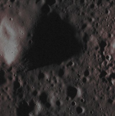 Mercurian Hill (Absolute Natural Colors; credits for the additional process. and color.: Dr Paolo C. Fienga/Lunar Explorer Italia/Italian Planetary Foundation)
This Vertical Relief (a very small Hill perhaps?), photographed by the NASA - MESSENGER Spacecraft on March, 25, 2014, lies towards the Edge of Mercury's expansive Northern Plains. The Sun, at the time when the picture was taken, was already very low on the Local Mercurian Horizon (---> only 6°), and this circumstance caused the creation of a long Shadow, approximately 3,3 Km (such as about 2,04 miles) long. 
Using a simple formula (actually, it is a Trigonometric relationship) - and knowing, in addition to the length of the Shadow, the Local Solar Incidence Angle - it was easy to calculate  the height of the Hill, which is approx.(~) 340 meters (such as about (~) 0,2111 miles). 
This Vertical Relief, according to NASA Planetary Scientists, could be (even thougb we, as IPF, stronglt disagree with such an hypothesis) a partial remnant of the Rim of an old Impact Crater that, some time in a very remote past of Mercury, was flooded (---> invaded and then almost completely covered) by fluid Lava. North is to the right of this image.

Date acquired: March, 25th, 2014
Image Mission Elapsed Time (MET): 38066727
Image ID: 6000245
Instrument: Narrow Angle Camera (NAC) of the Mercury Dual Imaging System (MDIS)
Center Latitude: 83,92° North
Center Longitude: 242,30° East
Solar Incidence Angle: 84,0° (meaning that the Sun, at the time that the picture was taken, was about 6,0° above the imaged Local Mercurian Horizon)
Emission Angle: 1,9°
Sun-Mercury-Messenger (or "Phase") Angle: 82,0°

This picture (which is an Original NASA - MESSENGER Spacecraft's b/w and NON Map-Projected image published on the NASA - Planetary Photojournal with the ID n. PIA 18248) has been additionally processed, contrast enhanced, Gamma corrected, magnified to aid the visibility of the details and then colorized in Absolute Natural Colors (such as the colors that a human eye would actually perceive if someone were onboard the NASA - MESSENGER Spacecraft and then looked outside, towards the Surface of Mercury), by using an original technique created - and, in time, dramatically improved - by the Lunar Explorer Italia Team. Different colors, as well as different shades of the same color, mean, among other things, the existence of different Elements (Minerals) present on the Surface of Mercury, each having a different Albedo (---> Reflectivity) and Chemical Composition.
Parole chiave: Mercury from orbit - Hill