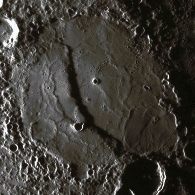 Long and High Scarp (Natural Colors; credits: Lunar Explorer Italia)
The Scarp cutting through this Unnamed Crater was imaged as MESSENGER approached the Planet during the mission's second Mercury flyby. The full NAC image acquired by MDIS is shown in a previous release (see PIA11772) while the image shown here is a reprojected view. Compare the two images to see the differences. 
By using very precise knowledge about the time that the image was taken and the location of the Spacecraft at that time, the original image can be mapped onto a globe of Mercury. Once mapped onto a Mercury globe, that globe can be viewed in many different ways, including reprojections that create flat maps of Mercury's Surface, as seen in the Global Map of Mercury (see PIA11403). The reprojected image shown here is from a simple cylindrical map projection. Map projections are needed to measure accurately the extent of features on the surface. For example, from this reprojection it was determined that this Scarp is about 1 Km (0,6 miles) high and over 160 Km (about 100 miles) in length. MESSENGER Science Team members recently published an image similar to this reprojection in Science magazine. 

Date Acquired: October 6, 2008
Image Mission Elapsed Time (MET): 131766501
Instrument: Narrow Angle Camera (NAC) of the Mercury Dual Imaging System (MDIS)
Resolution: 420 meters/pixel (0,26 miles)
Scale: This crater is about 200 Km (about 124 miles) in diameter
Spacecraft Altitude: 16.300 Km (about 10.100 miles)
Parole chiave: Mercury