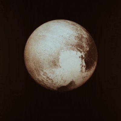 The "White Heart" of Pluto (Absolute Natural Colors; credits for the additional process. and color.: Dr Paolo C. Fienga - Lunexit Team)
A beautiful image, obtained by the Long Range Reconnaissance Imager (or "LORRI", for short), located onboard the NASA - New Horizons Spacecraft, when the probe was about 0,8 Million KiloMeters away from the Target. This frame, in our humble opinion, needs no comments at all: we, as IPF, have named it "The White Heart" of Pluto. And that is it. For now, of course...

The image (which is an Original NASA - New Horizons Spacecraft's b/w and NON Map-Projected frame published on the NASA - Mew Horizons LORRI Image Catalog with the ID n. lor_0299124574_0x632_sci_1) has been additionally processed, magnified to aid the visibility of the details, contrast enhanced and sharpened, Gamma corrected and then colorized (according to an educated guess carried out by Dr Paolo C. Fienga-LXTT-IPF) in Absolute Natural Colors (such as the colors that a normal human eye would actually perceive if someone were onboard the NASA - New Horizons Spacecraft and then looked ahead, towards the Dwarf-Planet Pluto), by using an original technique created - and, in time, dramatically improved - by the Lunar Explorer Italia Team.
Parole chiave: Pluto