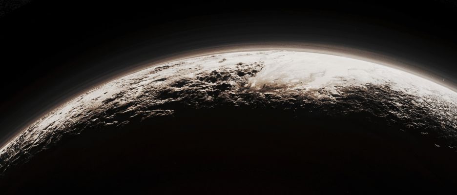 15 Minutes after Pluto - Large View (Absolute Natural Colors; credits for the additional process. and color.: Dr Paolo C. Fienga - Lunexit Team)
Just 15 minutes after its Closest Approach to Pluto - which occurred on July, 14, 2015 -, the NASA - New Horizons Spacecraft looked back toward the Sun and captured this simply beautiful Near-Sunset View of the rugged, Icy Mountains and flat Ice Plains extending all over around and to Pluto's Horizon and Terminator Line. 
The smooth expanse of the Icy Plains which have (so far) been informally named Sputnik Planum (watch to the right - Dx - of the picture) is flanked to the West (left - Sx) by rugged Mountains that reach up an altitude of approx. 11.000 feet (such as, roughly, 3352,8 meters), including the (even in this case, so far) informally named Norgay Montes (visible in the foreground) and the Hillary Montes, visible on the Skyline (---> Outer Edge/Horizon of Pluto). To the right (Dx), such as to the East of Sputnik Planum, some rougher (---> highly irregular) Terrain is cut by - what they appear to be - Glaciers. Furthermore, the backlighting, highlights several Layers of Haze in Pluto's tenuous - but quite uniform and highly distended - Atmosphere. 

This image was taken from a distance of about 11.000 miles (such as approx. 17.702,74 Km) from the Surface of Pluto; finally, the whole scene is roughly 780 miles (about 1.255,2852 Km) wide. 

The image (which is an Original NASA - New Horizons Spacecraft's b/w and NON Map-Projected frame published on the NASA - Planetary Photojournal with the ID n. 19948) has been additionally processed, magnified to aid the visibility of the details, contrast enhanced and sharpened, Gamma corrected and then colorized (according to an educated guess carried out by Dr Paolo C. Fienga-LXTT-IPF) in Absolute Natural Colors (such as the colors that a normal human eye would actually perceive if someone were onboard the NASA - New Horizons Spacecraft and then looked outside, towards the Dwarf-Planet Pluto), by using an original technique created - and, in time, dramatically improved - by the Lunar Explorer Italia Team.
Parole chiave: Pluto