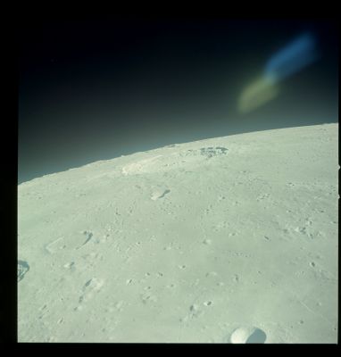 AS 12-51-7542 - UFO near Copernicus? No, just a reflection... (1)
Grazie alla splendida collaborazione e costante cortesia del Lunar & Planetary Institute, ecco per Voi le versioni restaurate di alcuni frames che hanno contribuito a creare, allo stesso tempo, un pò di Storia ed un pò di Leggenda: le "luci misteriose" che si accesero sopra la Luna e che vennero immortalate da questo frame (ed altri similari) erano degli UFO? 
Secondo noi, dopo aver visionato queste immagini, si può dire "NO". Non erano UFO.

La configurazione dell'Anomalìa, infatti, unita alla sua posizione, tessitura e colorazione, ci spingono a ritenere che quanto ripreso in questo frame - come in altri che seguono (alcuni anche relativi ad altre - successive - Missioni) - è solo il riflesso di una coppia di led interni all'astronave. Purtroppo, noi non siamo in grado di dirVi quale tipo di led possa aver causato un simile effetto e, da questo punto di vista, anche il Lunar & Planetary Institute non ci può essere di aiuto.

Conclusioni: questo frame, al pari di tanti altri simili, rimane necessariamente un frame ambiguo e controverso, ma l'ipotesi che la coppia di "U" luminose sia, in effetti, una coppia di UFO - oppure un singolo UFO di forma davvero bizzarra - a noi non sembra più tanto agevolmente sostenibile nè sponsorizzabile. 
Con buona pace del CUN (che questi Original NASA-Apollo Frames non li ha MAI visti nè esaminati...).
Parole chiave: The Moon from orbit - Controversial Frame