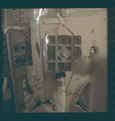 AS 13-62-8930 - The "home-made" Air-Cleaning Device (2)
Caption NASA originale:"Inflight photo of the device constructed by the Crew from duct tape, maps and other materials they had on hand as per instructions provided by Houston. 
This device allowed use of box-shaped Command Module Lithium Hydroxide canisters in conjunction with the LM Environmental Control System, which is the large white unit that fills most of the frame. The LM LiOH canisters were cylindrical in shape and fit into the receptacles at the lower left. Compare with the LM-ECS diagram".
Parole chiave: Inside the Apollo 13