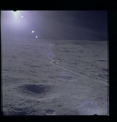 AS 14-67-9367 - Up-Sun (Special Processing by Lunexit)
Caption NASA:"117:19:37 MT - This up-Sun photo was taken from near the ALSEP Central Station back toward the LM in order to provide relative location information. 
As with the Astronauts' bootprints, the track made by the MET tires are compact, smooth and, as can be seen so dramatically in this picture, more highly reflective than the rough undisturbed surface".
Parole chiave: Lunar Surface - Disturbed and Undisturbed Soil