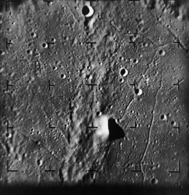 The Moon from Ranger-9: Alphonsus Crater (2)
Caption NASA:"Ranger 9 image taken 54 seconds before impact. The upraised area at lower center is the central peak of Alphonsus Crater floor. This image was taken from a distance of 136 Km. 
The impact point of Ranger 9 is to the right of the central reticle, about 60% of the way from the central reticle to the edge of the frame. 
The image is 60 Km across and North is at 12:30 (Ranger 9, A060)".
Parole chiave: The Moon